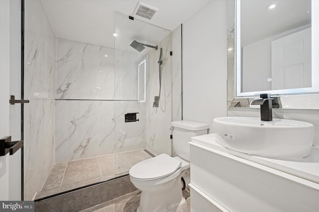 bathroom with vanity, a marble finish shower, recessed lighting, toilet, and visible vents