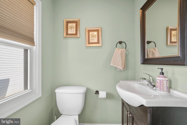 bathroom with toilet and vanity