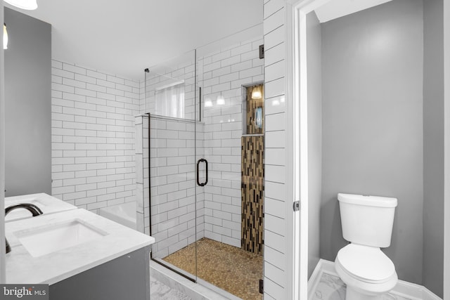 full bathroom featuring marble finish floor, a stall shower, toilet, and baseboards