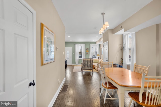 dining room with recessed lighting, visible vents, baseboards, and hardwood / wood-style flooring