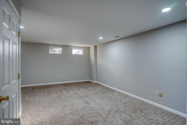 below grade area featuring visible vents, recessed lighting, baseboards, and carpet floors