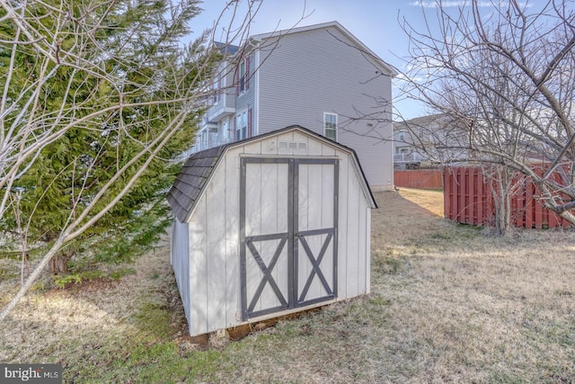 view of shed with fence