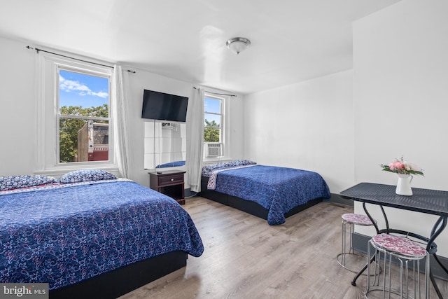 bedroom with wood finished floors