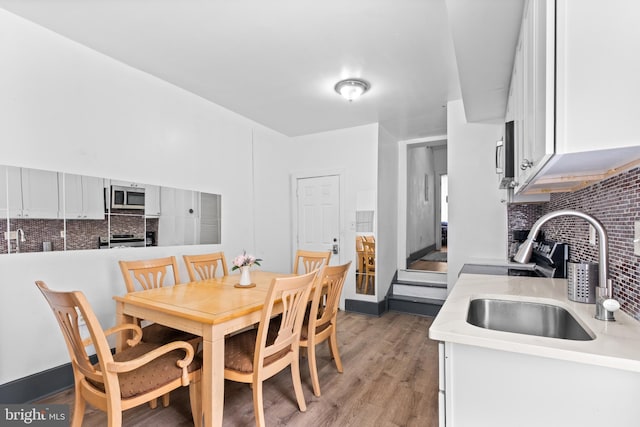 dining space with light wood-style floors