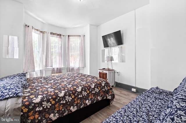 bedroom featuring wood finished floors