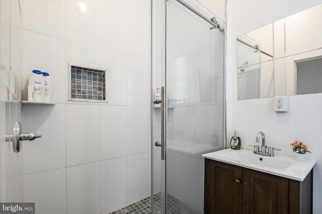 bathroom with vanity and a stall shower