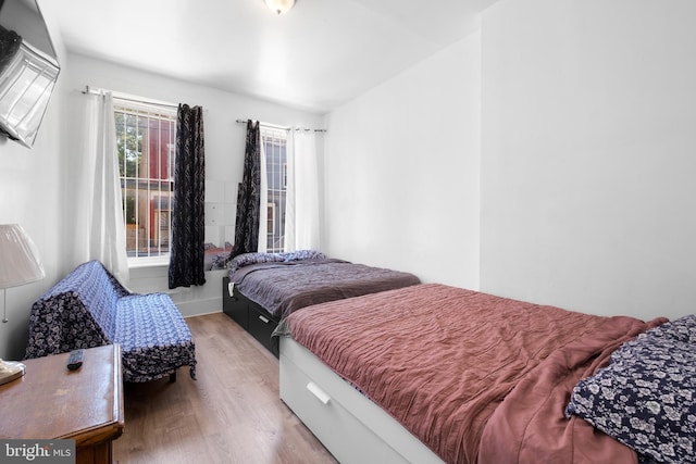 bedroom featuring wood finished floors