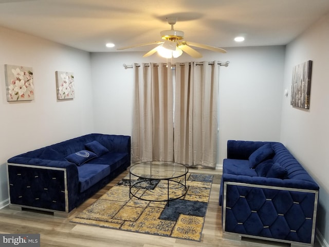 living area with recessed lighting, wood finished floors, and a ceiling fan