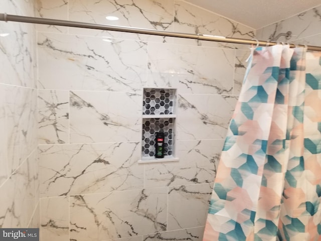 bathroom featuring a shower with curtain