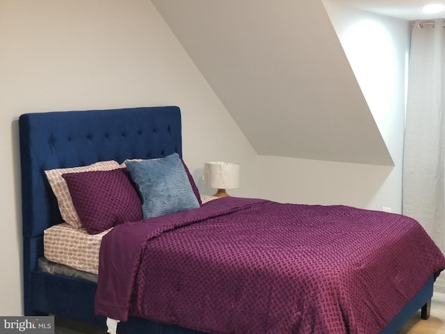 bedroom featuring vaulted ceiling