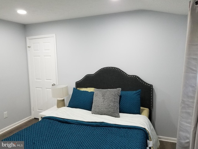 bedroom featuring recessed lighting, baseboards, and wood finished floors