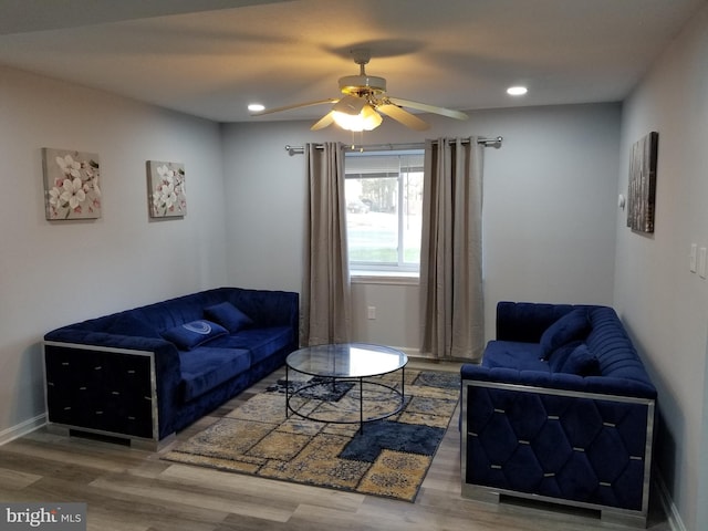 living area with recessed lighting, wood finished floors, baseboards, and ceiling fan