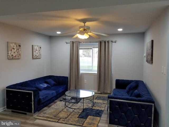 living area featuring a ceiling fan, recessed lighting, wood finished floors, and baseboards