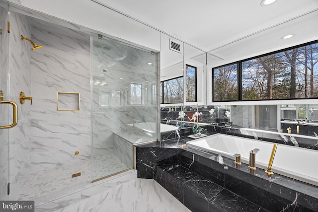 bathroom featuring recessed lighting, a marble finish shower, a garden tub, and marble finish floor