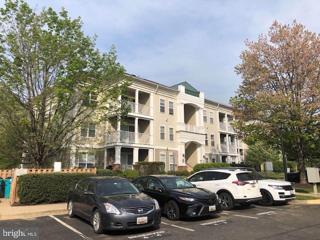 view of building exterior featuring uncovered parking