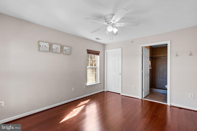 unfurnished bedroom with visible vents, baseboards, ceiling fan, and hardwood / wood-style flooring