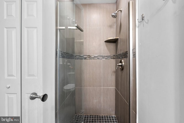 bathroom featuring a shower stall