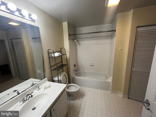 full bathroom with tile patterned flooring, shower / washtub combination, toilet, a closet, and vanity