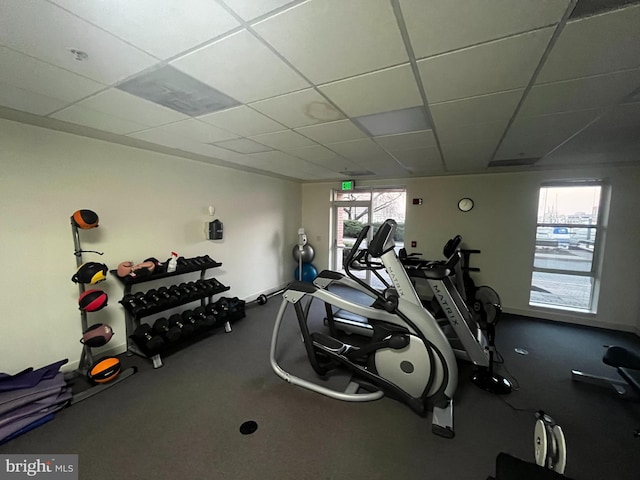 workout area with a paneled ceiling