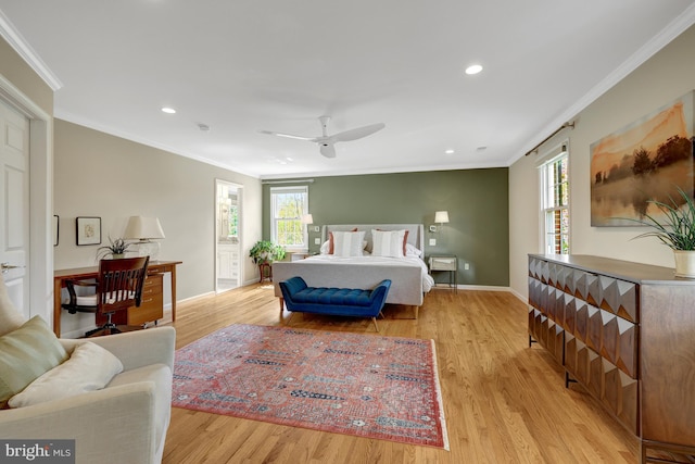 bedroom featuring multiple windows and light wood-style floors