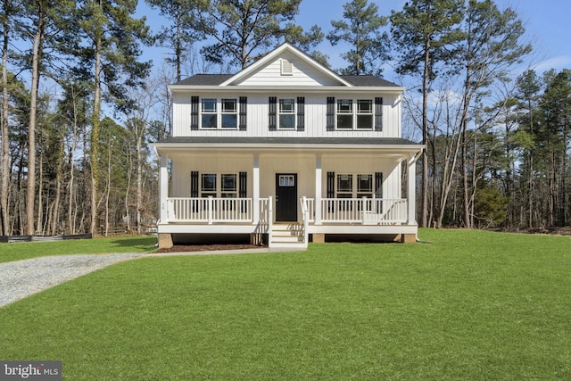 view of front of property with covered porch, board and batten siding, a shingled roof, and a front lawn