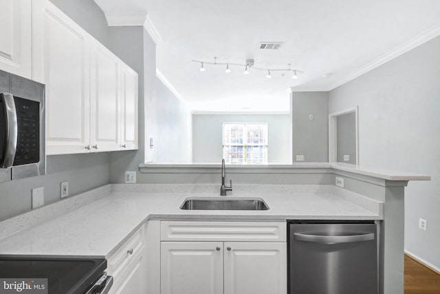 kitchen with visible vents, ornamental molding, stainless steel appliances, white cabinetry, and a sink