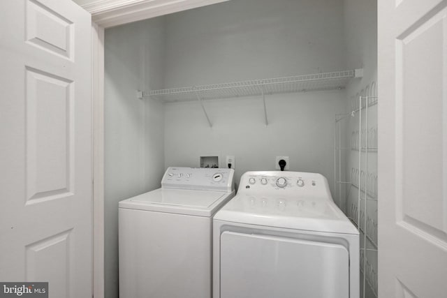 clothes washing area featuring laundry area and independent washer and dryer