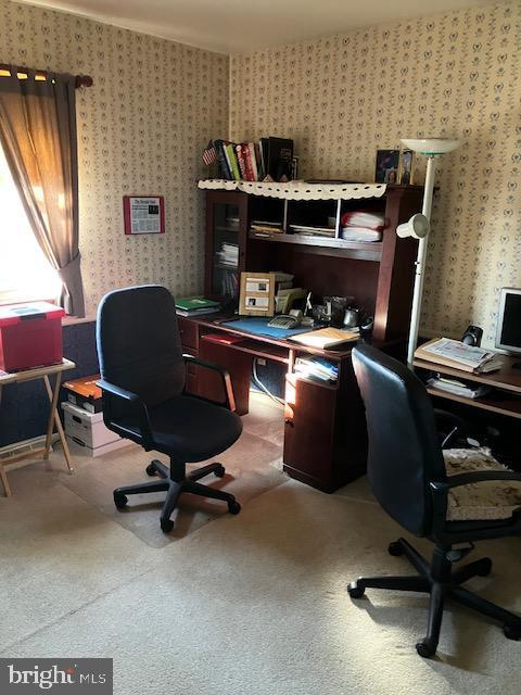 office with wallpapered walls