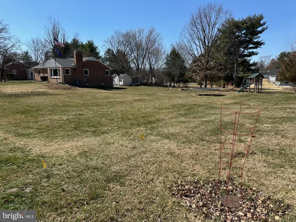 view of yard with a playground