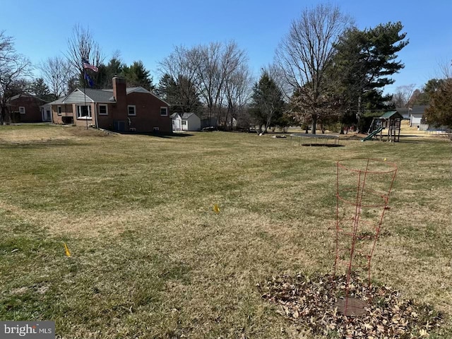 view of yard with a playground