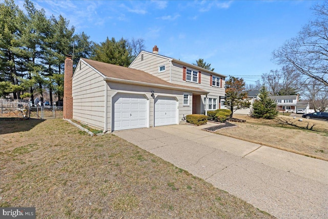 view of front of house with a front yard, fence, an attached garage, a chimney, and concrete driveway