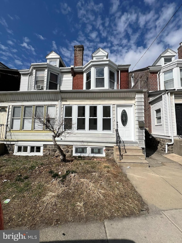 multi unit property with entry steps and a chimney