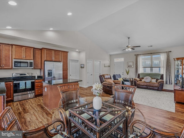 dining space with recessed lighting, wood finished floors, and a ceiling fan