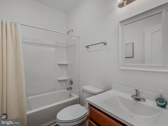 bathroom with vanity, toilet, and shower / bath combo with shower curtain