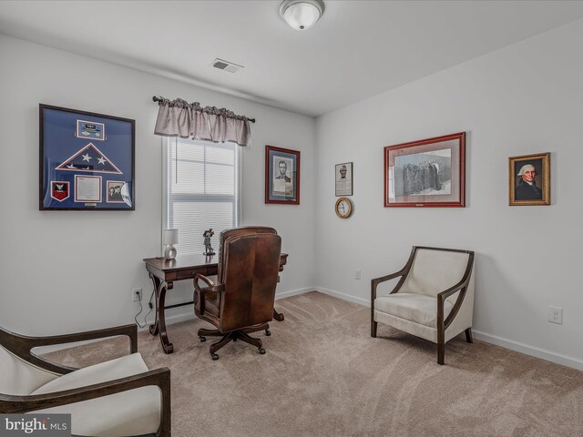 office area with baseboards, visible vents, and carpet floors