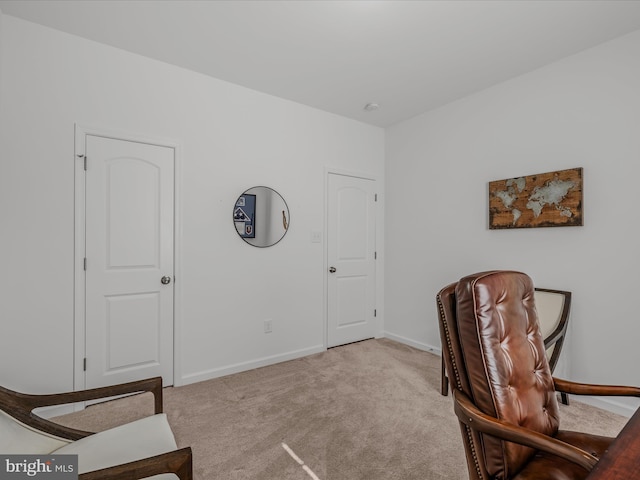 sitting room with carpet flooring and baseboards