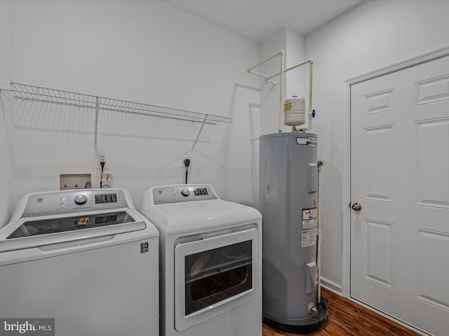 washroom with laundry area, dark wood-style floors, water heater, and washing machine and clothes dryer