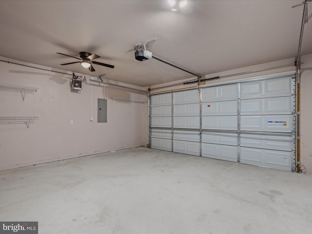 garage featuring electric panel and a garage door opener