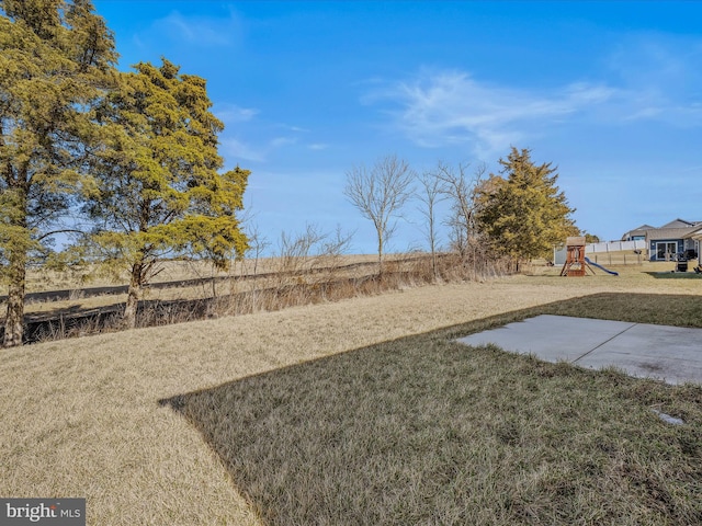 view of yard with a playground