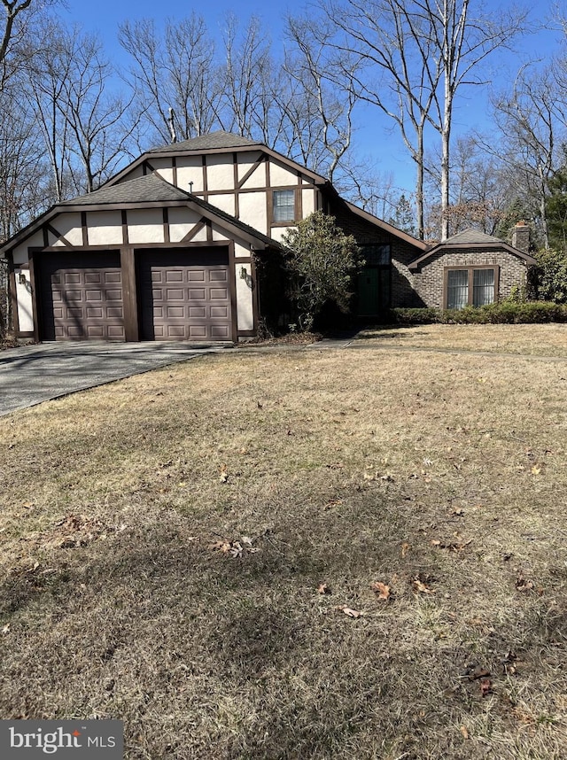 garage featuring aphalt driveway