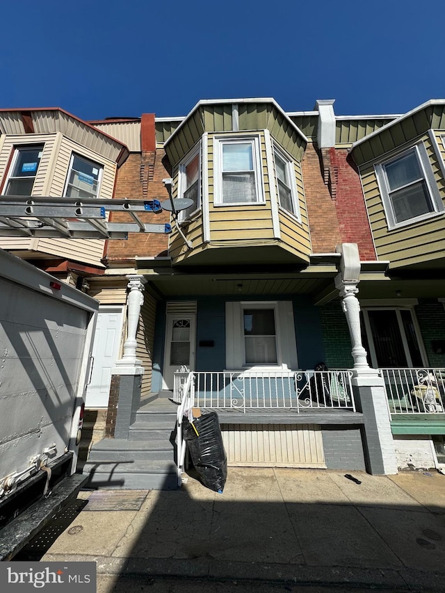 multi unit property featuring a porch