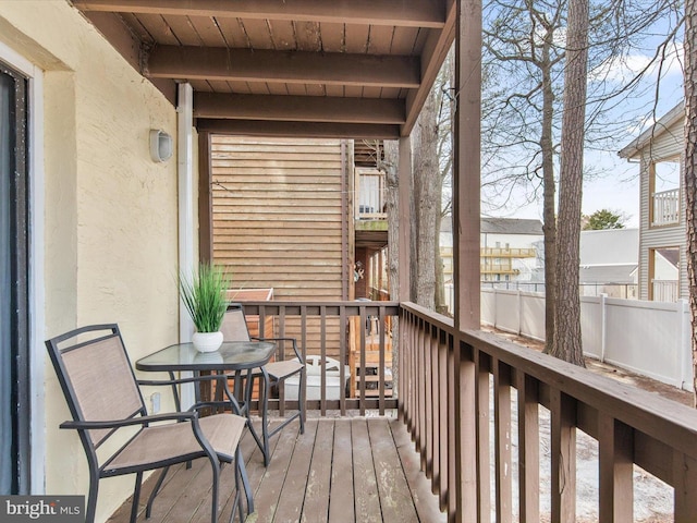 sunroom / solarium with beamed ceiling and wood ceiling