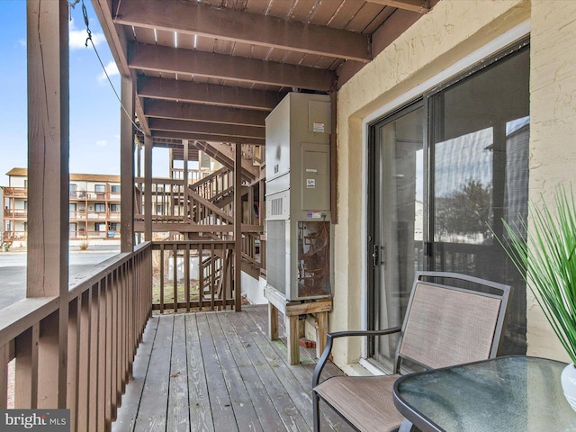 wooden terrace with outdoor dining space