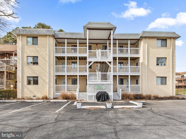 view of property with uncovered parking