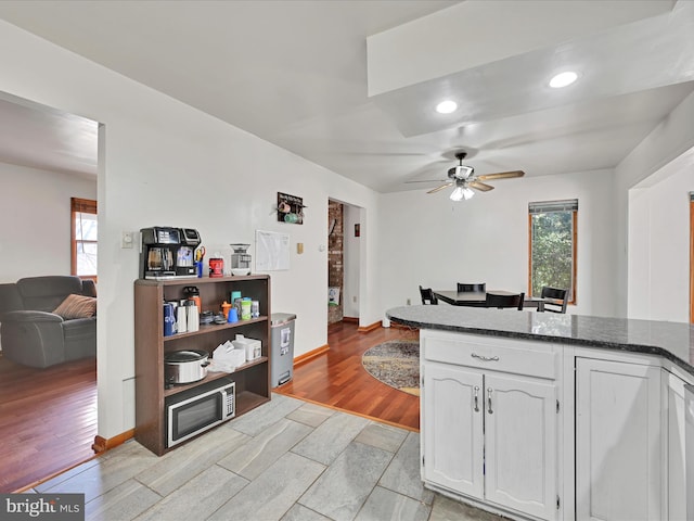 kitchen with ceiling fan, open floor plan, recessed lighting, light wood-style floors, and white cabinets