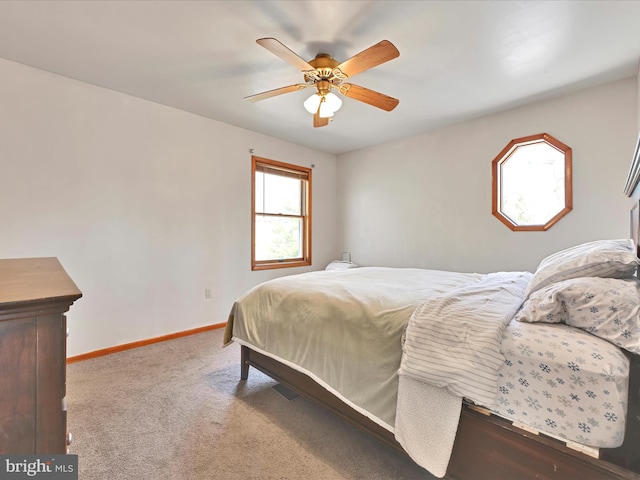 bedroom with baseboards, carpet floors, and ceiling fan