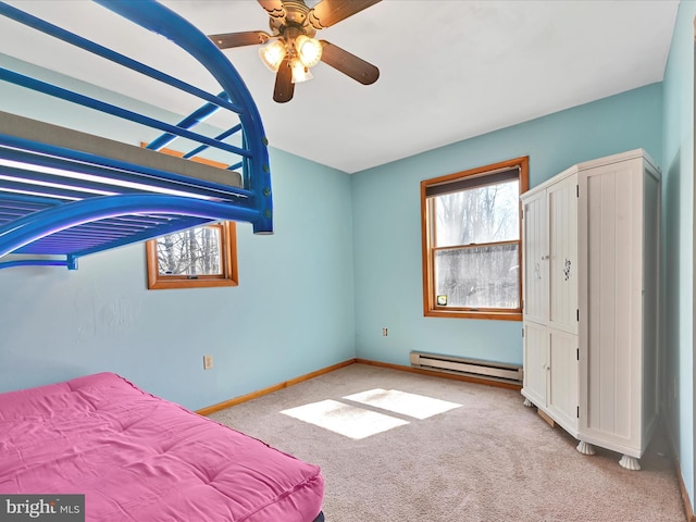 unfurnished bedroom with carpet flooring, a ceiling fan, baseboards, and baseboard heating