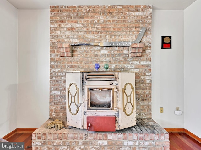 interior details featuring baseboards and wood finished floors