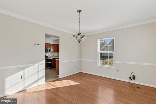 unfurnished dining area featuring a chandelier, light wood-type flooring, baseboards, and ornamental molding