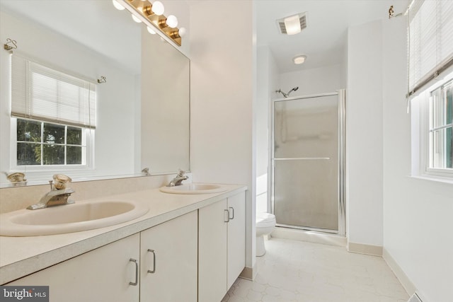 full bath featuring a sink, visible vents, and a shower stall